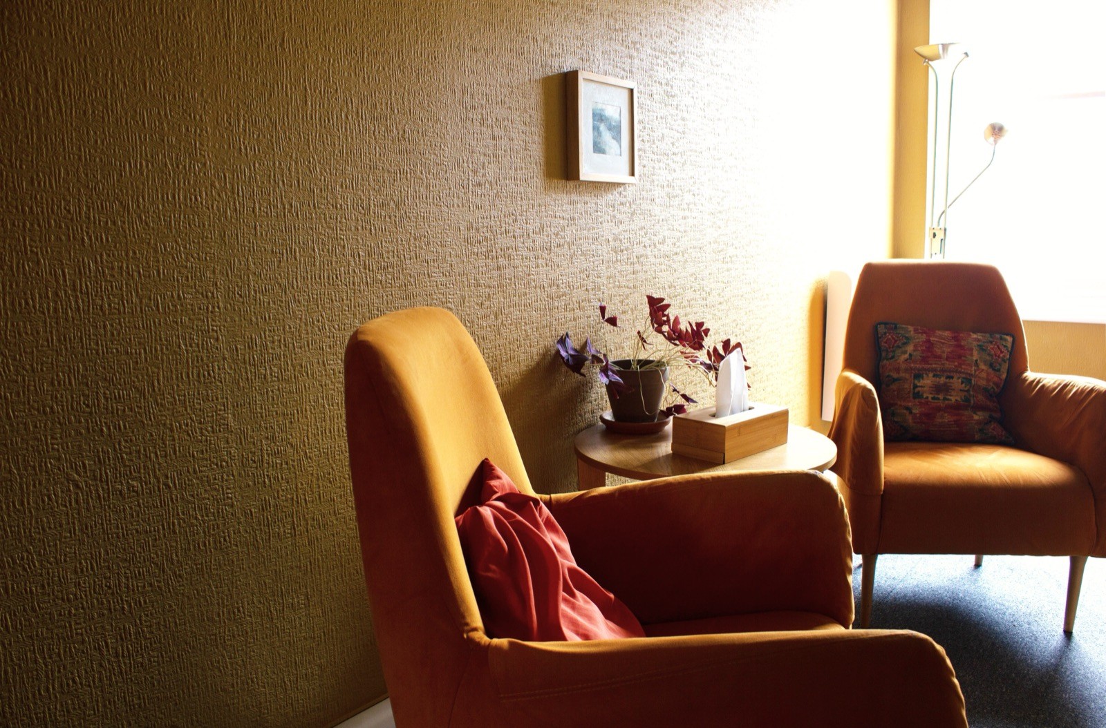 A New Road therapy room with two upholstered armchairs